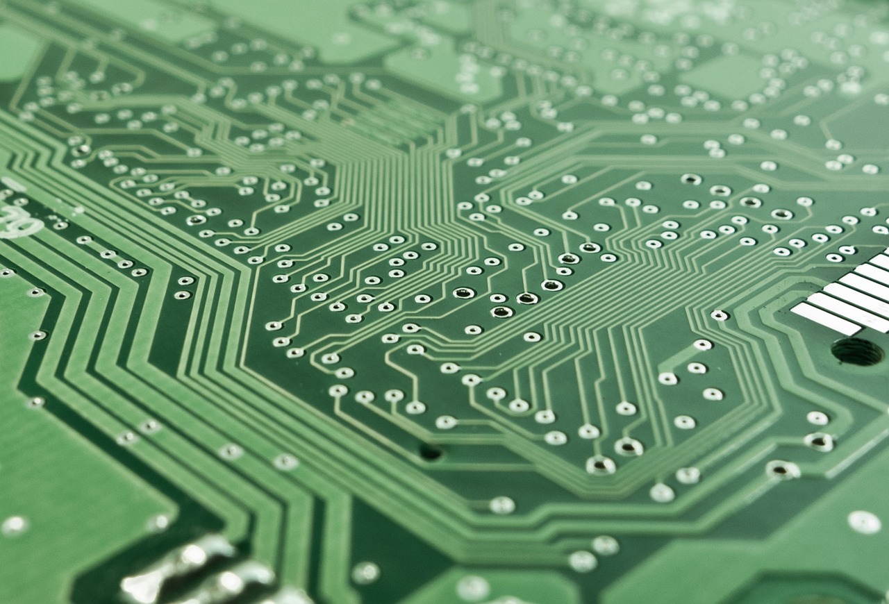 Detailed PCB routing and copper traces on a green circuit board